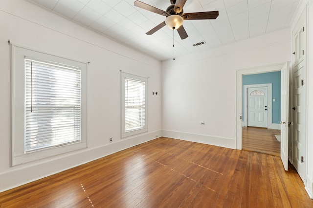 spare room featuring ceiling fan and wood-type flooring