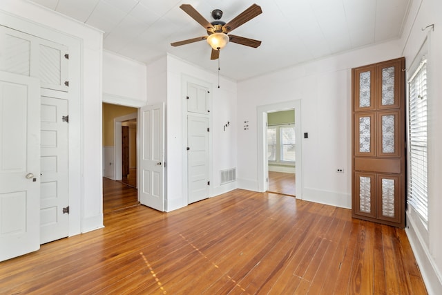 foyer entrance featuring ceiling fan, wood-type flooring, and french doors