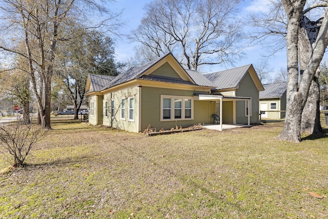 exterior space with a front lawn and a patio area