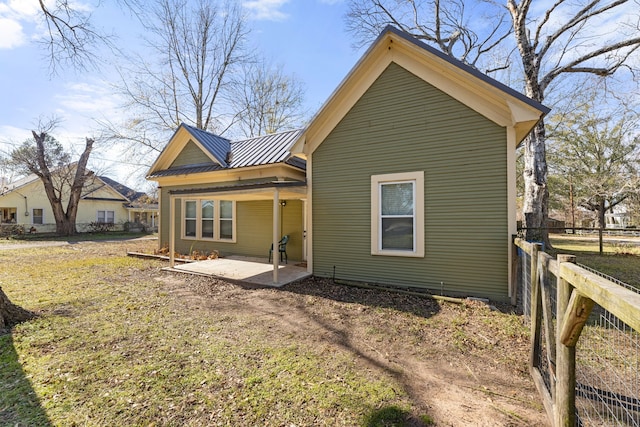 rear view of house with a patio