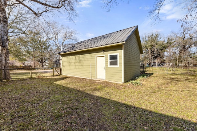 view of outbuilding featuring a yard