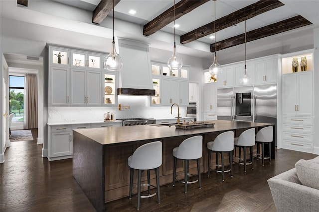 kitchen featuring sink, white cabinets, and a spacious island