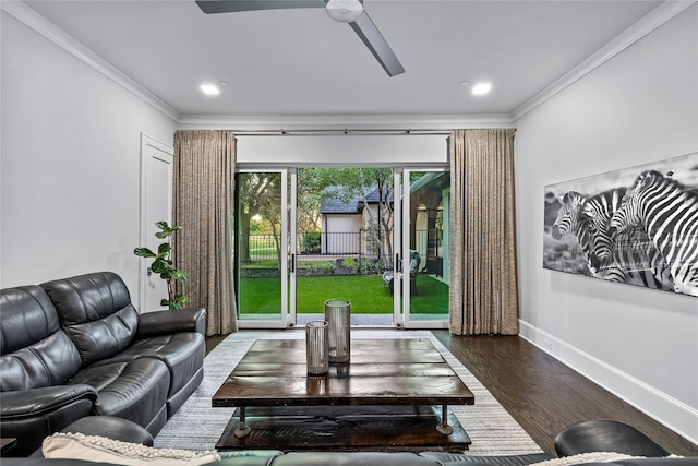 living room with ceiling fan, dark hardwood / wood-style floors, and ornamental molding