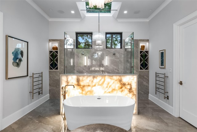 bathroom with a notable chandelier, separate shower and tub, and ornamental molding