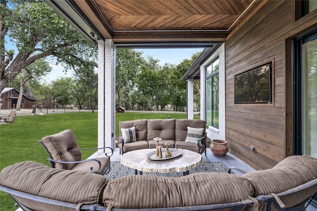 sunroom / solarium featuring wood ceiling