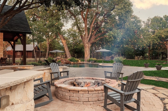 view of patio / terrace with an outdoor fire pit