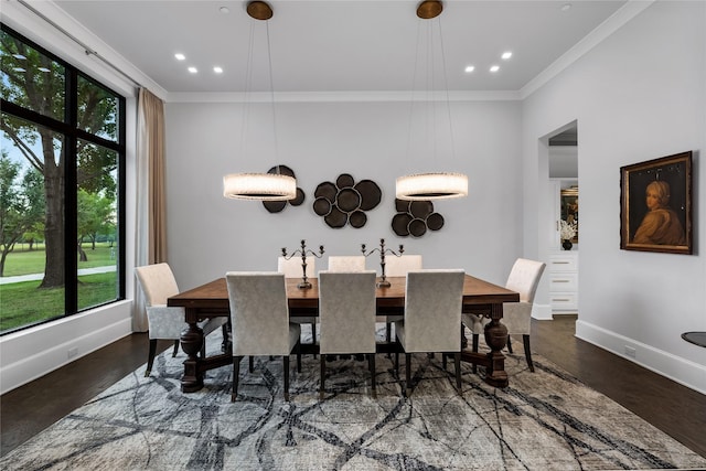 dining space featuring dark hardwood / wood-style flooring and ornamental molding