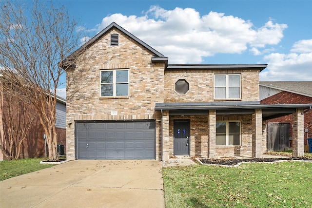 view of front property featuring a garage and a front yard