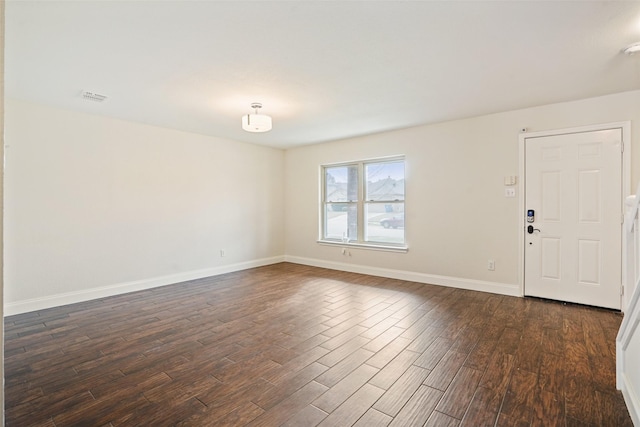 empty room with dark hardwood / wood-style floors