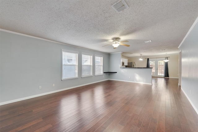 unfurnished living room with ceiling fan, french doors, crown molding, and dark hardwood / wood-style flooring