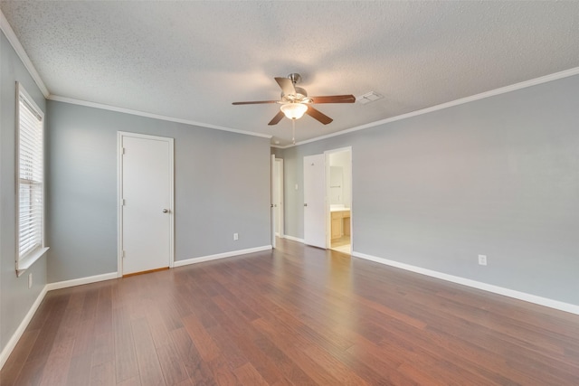 spare room featuring ceiling fan, ornamental molding, and dark hardwood / wood-style floors