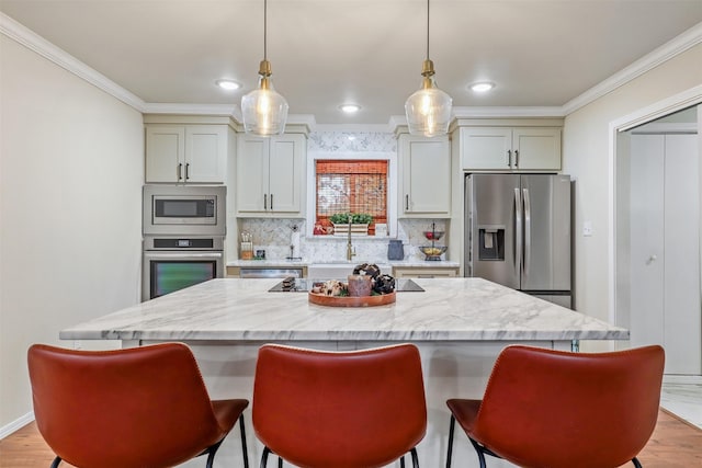 kitchen featuring light stone counters, a kitchen bar, and stainless steel appliances