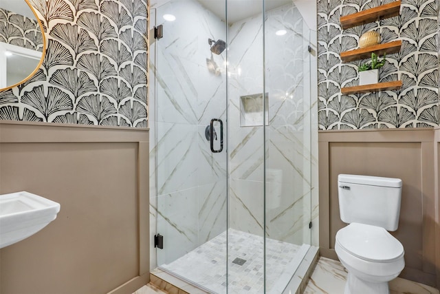 bathroom featuring walk in shower and toilet