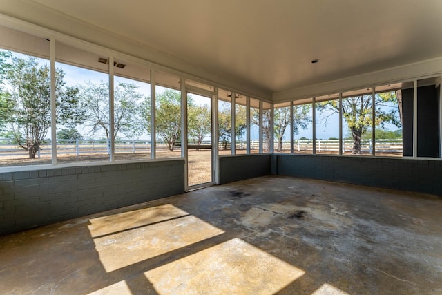 unfurnished sunroom featuring plenty of natural light