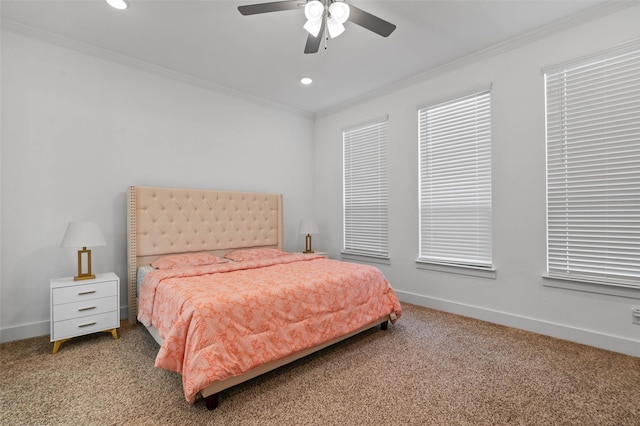 carpeted bedroom with ceiling fan and crown molding