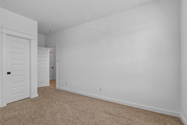 unfurnished bedroom with a closet and carpet