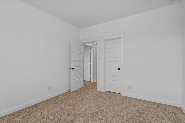 unfurnished bedroom featuring a closet and carpet floors