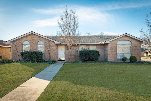 ranch-style house featuring a front lawn