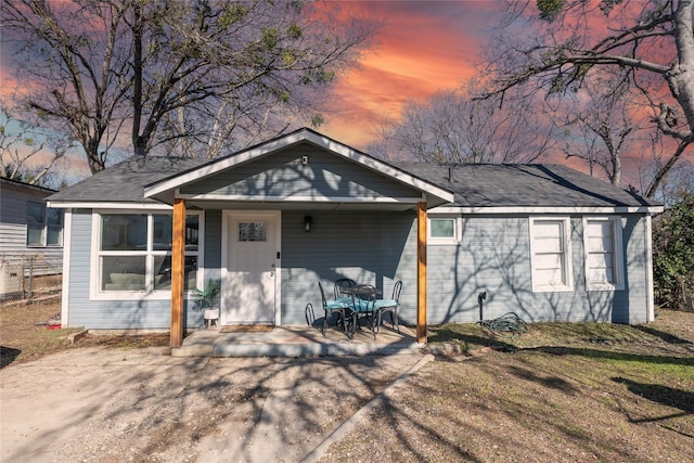 single story home with a patio area and a yard