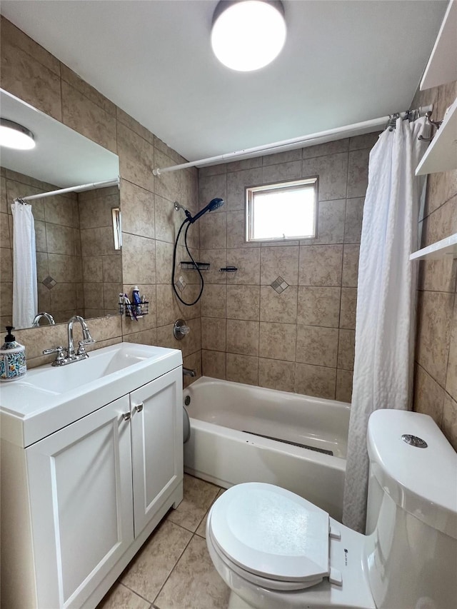 full bathroom with tile walls, vanity, tile patterned floors, and shower / bath combo with shower curtain