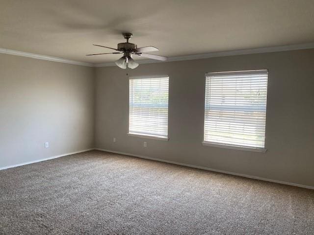 spare room with ceiling fan, a healthy amount of sunlight, and ornamental molding