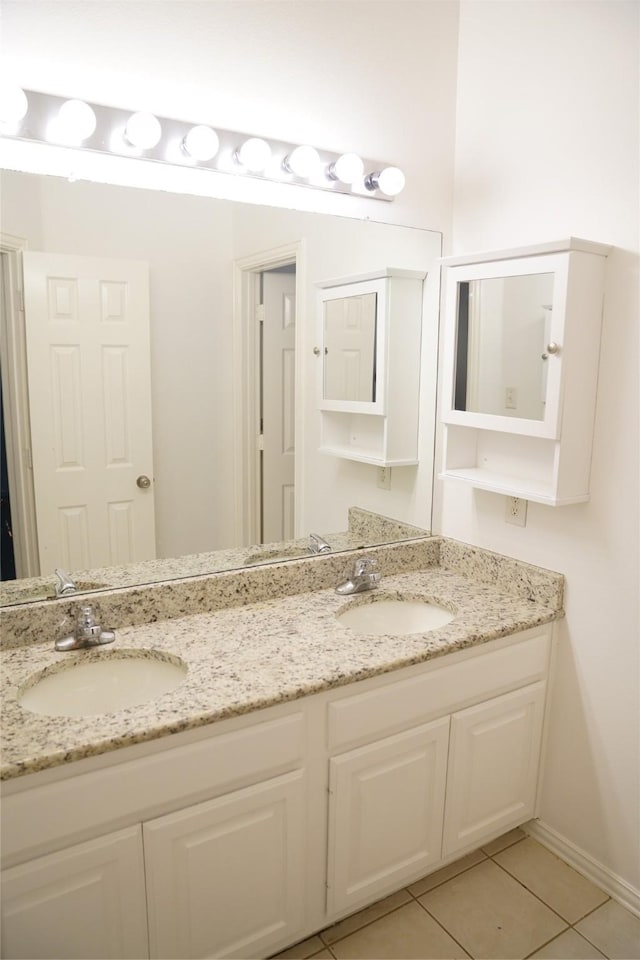 bathroom with vanity and tile patterned floors