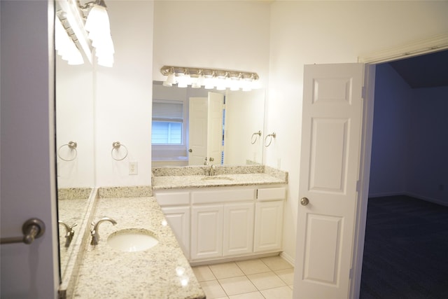 bathroom with tile patterned flooring and vanity