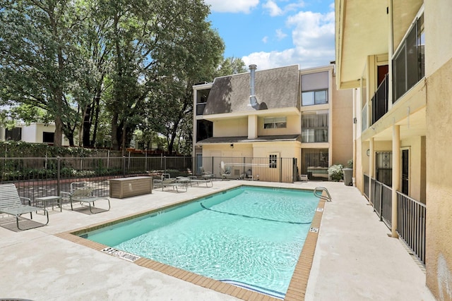 view of swimming pool with a patio