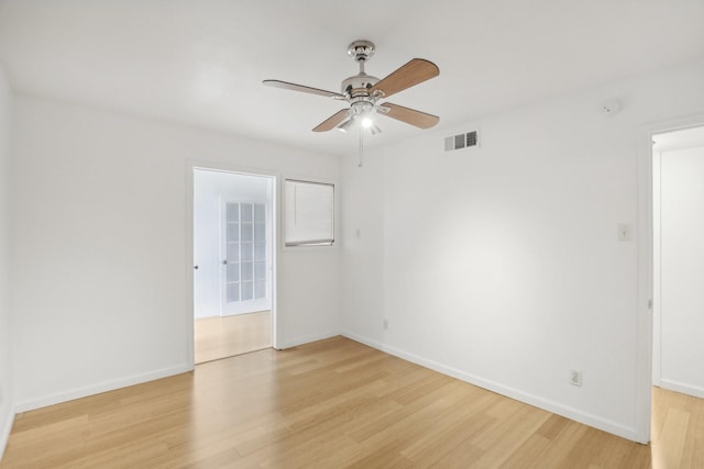 unfurnished room featuring ceiling fan and light hardwood / wood-style flooring