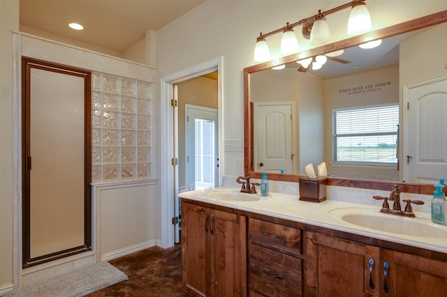 bathroom with vanity and a shower with shower door