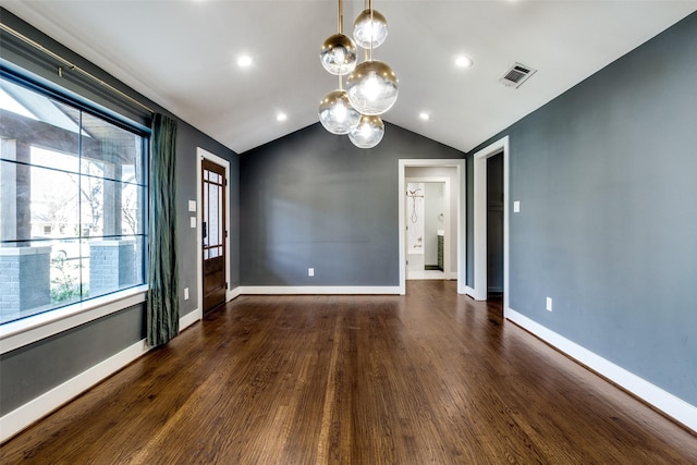 empty room with lofted ceiling and dark wood-type flooring