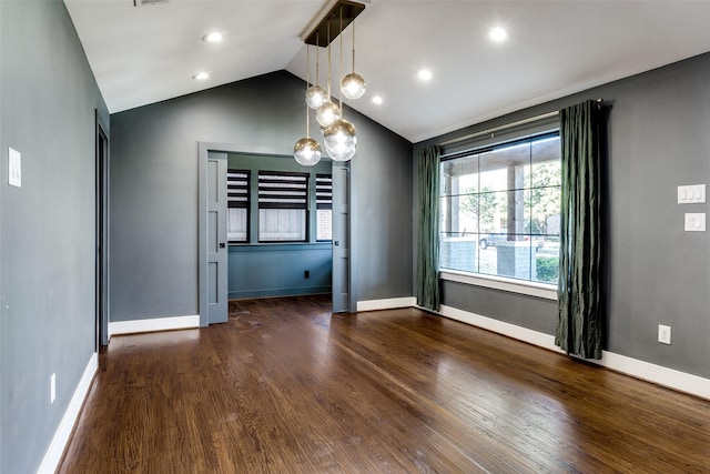 interior space with dark hardwood / wood-style flooring and vaulted ceiling