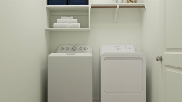 clothes washing area featuring washing machine and clothes dryer