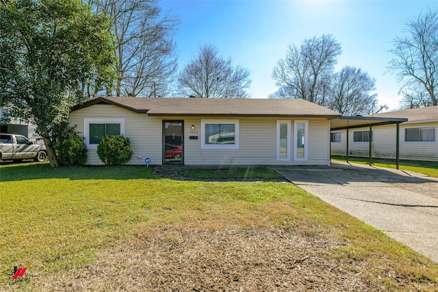 ranch-style home with a carport and a front yard