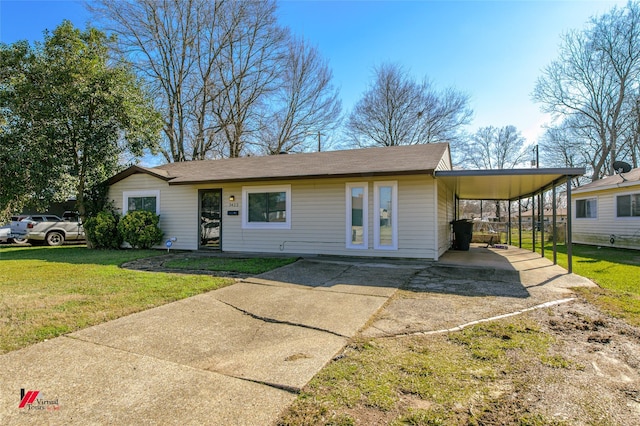 view of front of property featuring a carport and a front lawn