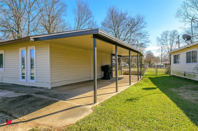 view of property exterior featuring a yard and a carport