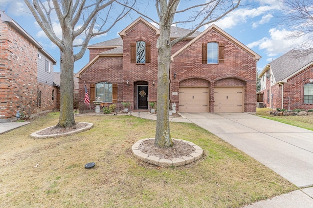 front of property with a front lawn and a garage