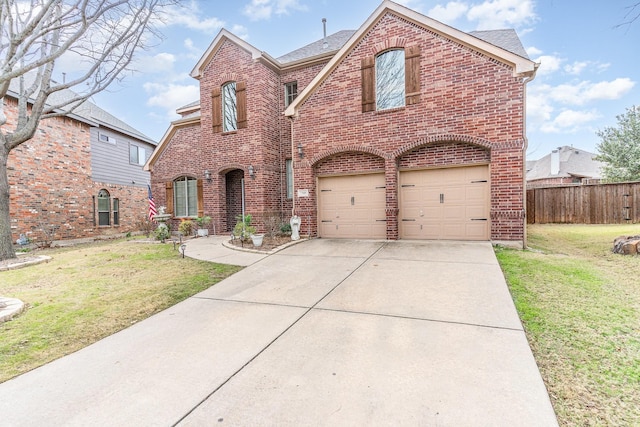 view of front of property with a garage and a front yard