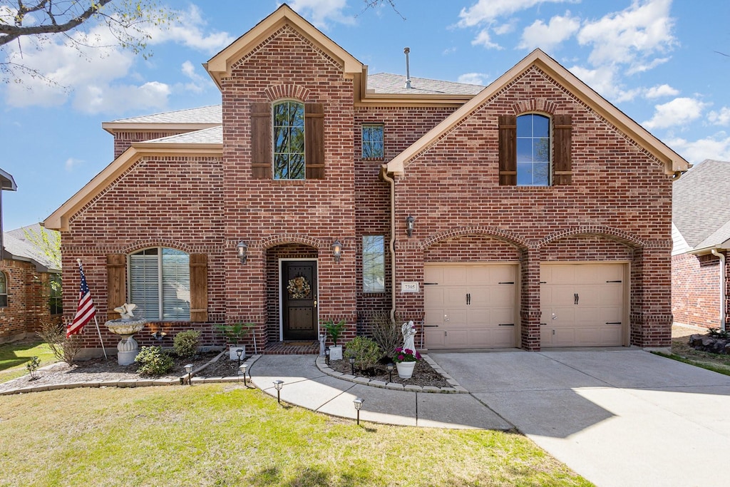 7305 Lawndale Ct, Mckinney, TX 75072 - traditional-style home featuring brick siding, a garage, and concrete driveway