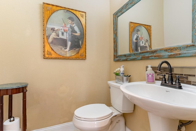 bathroom featuring sink and toilet