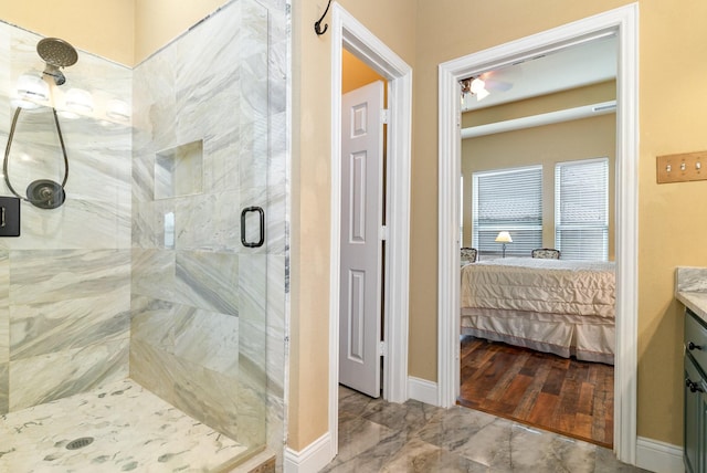 bathroom featuring vanity and a shower with door