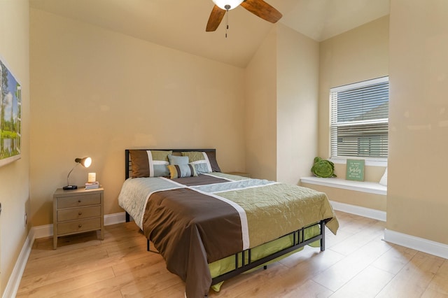 bedroom featuring vaulted ceiling, ceiling fan, and light hardwood / wood-style floors