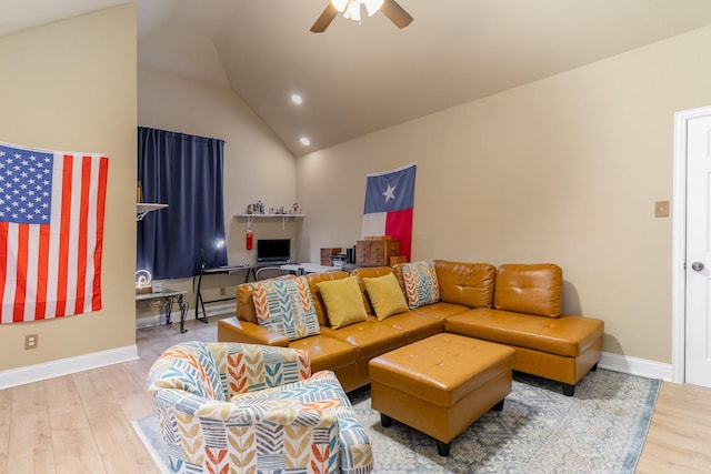 living room featuring lofted ceiling, hardwood / wood-style flooring, and ceiling fan