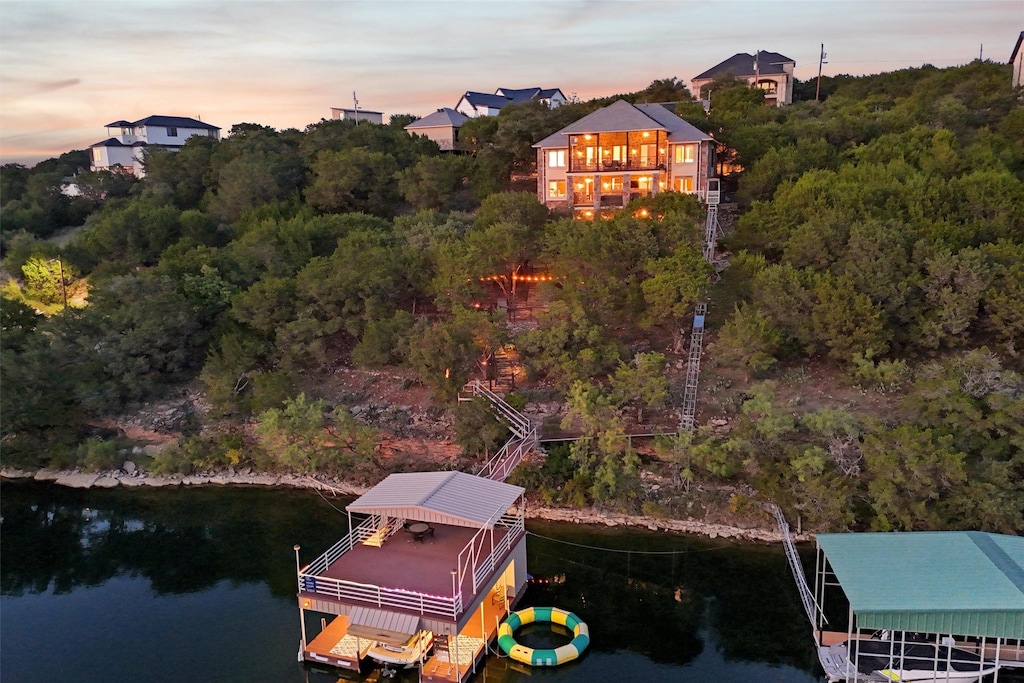 aerial view at dusk with a water view