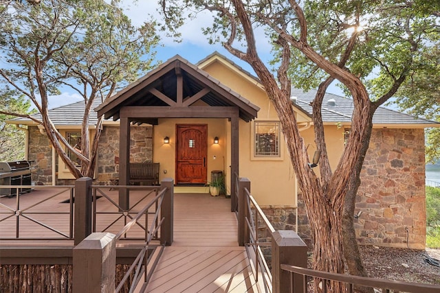 view of front of property with a wooden deck