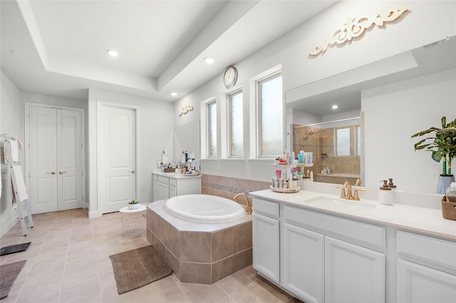 full bath with a garden tub, tile patterned flooring, a sink, and a shower stall