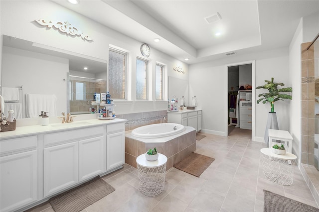 full bath with two vanities, a sink, visible vents, and a shower stall