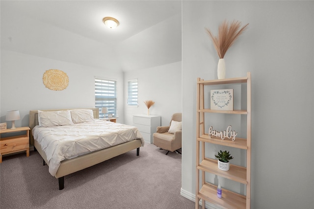 carpeted bedroom featuring vaulted ceiling