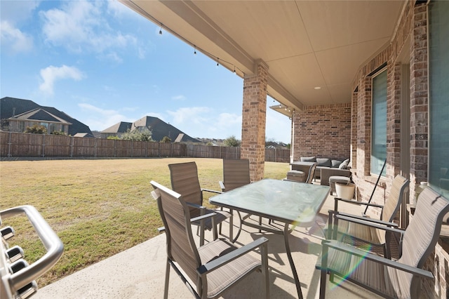 view of patio featuring a fenced backyard, an outdoor living space, and outdoor dining space