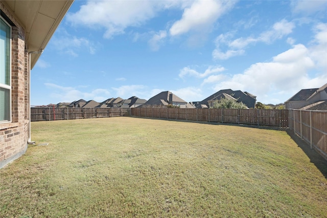 view of yard featuring a fenced backyard